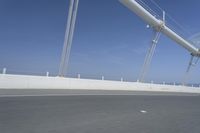 a man is riding his bicycle along the highway with a view of the sky in the background
