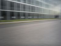 a man riding his bike through the city streets in motion on a blurry street