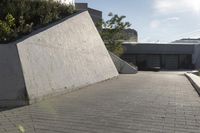 a view of an outside area of an office building with large windows and a circular driveway