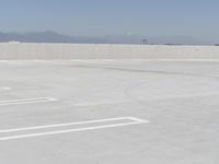 a man flying a kite while on his skateboard in the air outside an airport