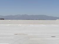 a man flying a kite while on his skateboard in the air outside an airport