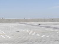 a man flying a kite while on his skateboard in the air outside an airport