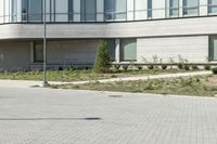 a man riding a skateboard in the street on a bike next to a building