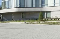 a man riding a skateboard in the street on a bike next to a building