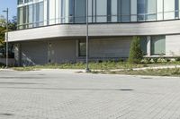 a man riding a skateboard in the street on a bike next to a building