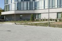 a man riding a skateboard in the street on a bike next to a building