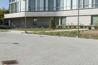 a man riding a skateboard in the street on a bike next to a building