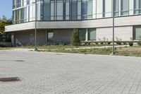 a man riding a skateboard in the street on a bike next to a building