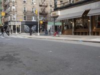 a man is walking on a sidewalk with a suitcase in one hand and the other in the other