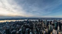 the skyline of new york city, ny at sunset from the empire building observation platform