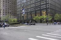 several people are walking and sitting in the street of new york city's financial district