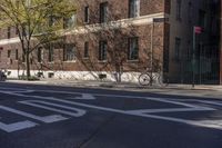 the street has a stop sign at the side on it and a bicycle on the road