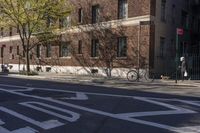 the street has a stop sign at the side on it and a bicycle on the road