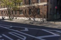 the street has a stop sign at the side on it and a bicycle on the road