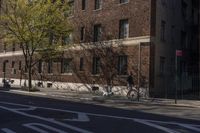 the street has a stop sign at the side on it and a bicycle on the road