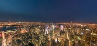 an image of the new york city skyline at night from a skyscraper overlooking the city