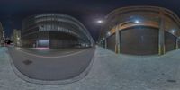 the view from a fish eye lens of an urban area at night time that looks very eerie