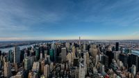 a view of the city from a high point of view overlooking the manhattan skyline at sunset