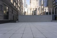 a sidewalk with no people on it between tall buildings and stairs on each side of it