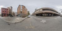 multiple pictures of a road with buildings and buildings on either side of the road one has a bike parked in front