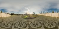 360 - view view of concrete walling, walkway and trees under blue cloudy skies