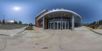 this is a fisheye panoramic photo taken at an open air stadium, showing the entrance and the stairs