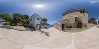 a spherical panorama panoramic shot of a nice house with a nice balcony and steps