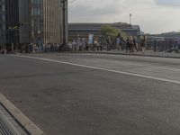 a large group of people are riding motorcycles in the city streets with no traffic on them