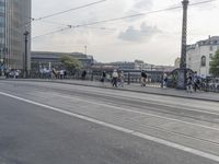 a large group of people are riding motorcycles in the city streets with no traffic on them