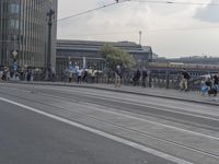 a large group of people are riding motorcycles in the city streets with no traffic on them