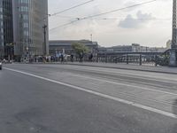 a large group of people are riding motorcycles in the city streets with no traffic on them