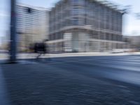 Metropolitan Berlin: Dynamic Cityscape with Urban Architecture and Tree-Lined Roads