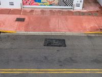 the entrance to an ice cream shop with a mural on the outside wall of it