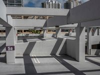 a building with concrete walls and ramps is shown from below the stairs of a car park