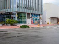 the street in front of this building is very wet and weted in to the ground