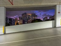 an empty parking garage has the city lights on at night, all painted white and purple