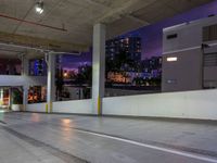 a view of a busy city street at night from an underground parking garage space, with a blue light from above