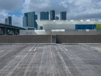 an empty car park and parking lot in front of the skyline in miami, fl