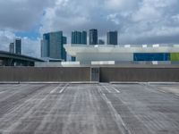 an empty car park and parking lot in front of the skyline in miami, fl