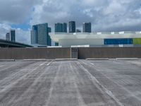 an empty car park and parking lot in front of the skyline in miami, fl