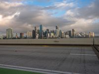 a view of the city from the freeway under cloudy skies in a scenic setting in chicago