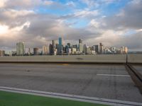 a view of the city from the freeway under cloudy skies in a scenic setting in chicago