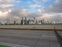 a view of the city from the freeway under cloudy skies in a scenic setting in chicago