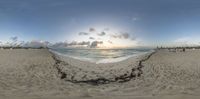 360 - view photo with a beach in the background showing sand and sky and water