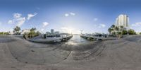 there are boats docked at the dock in this view of a city from a 360 - lens