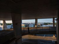 this is a view from a building with a ramp to the bridge over water and buildings in the background