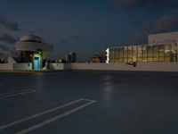 this is an image of a car in the parking lot at dusk for use in this commercial space