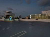 this is an image of a car in the parking lot at dusk for use in this commercial space