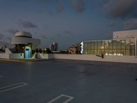 this is an image of a car in the parking lot at dusk for use in this commercial space