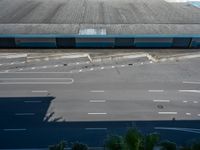 an empty lot with an empty parking lot in the background and clouds in the distance